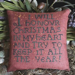 A Maroon Color Pillow With Black Lettering Stitched