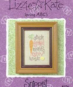 Framed spring carrot alphabet cross-stitch sampler