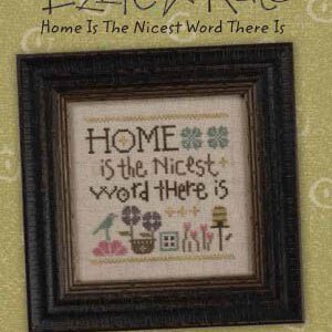 Framed cross-stitch sampler with home quote