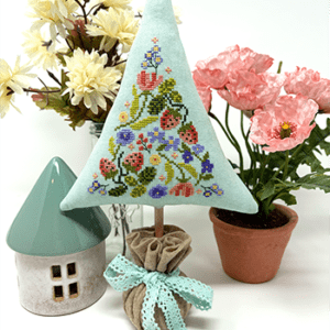 Embroidered triangular tree ornament with flowers